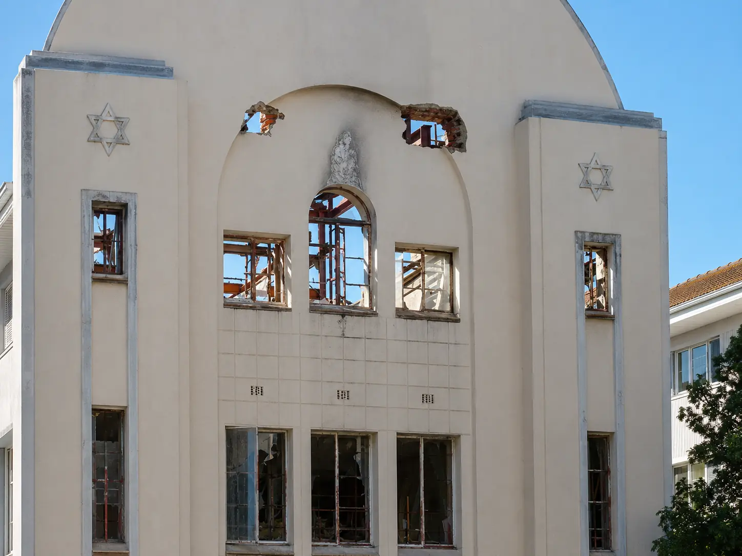 Close view of fire damage to the original steel windows at Beit Midrash Morasha