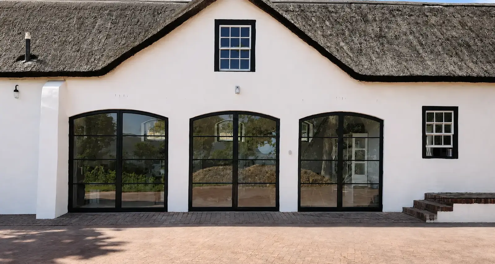 Detailed front elevation of the completed arched steel doors in Constantia