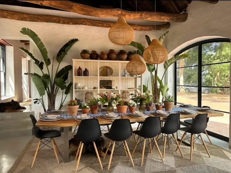 Custom arched steel doors opening from the Constantia dining room