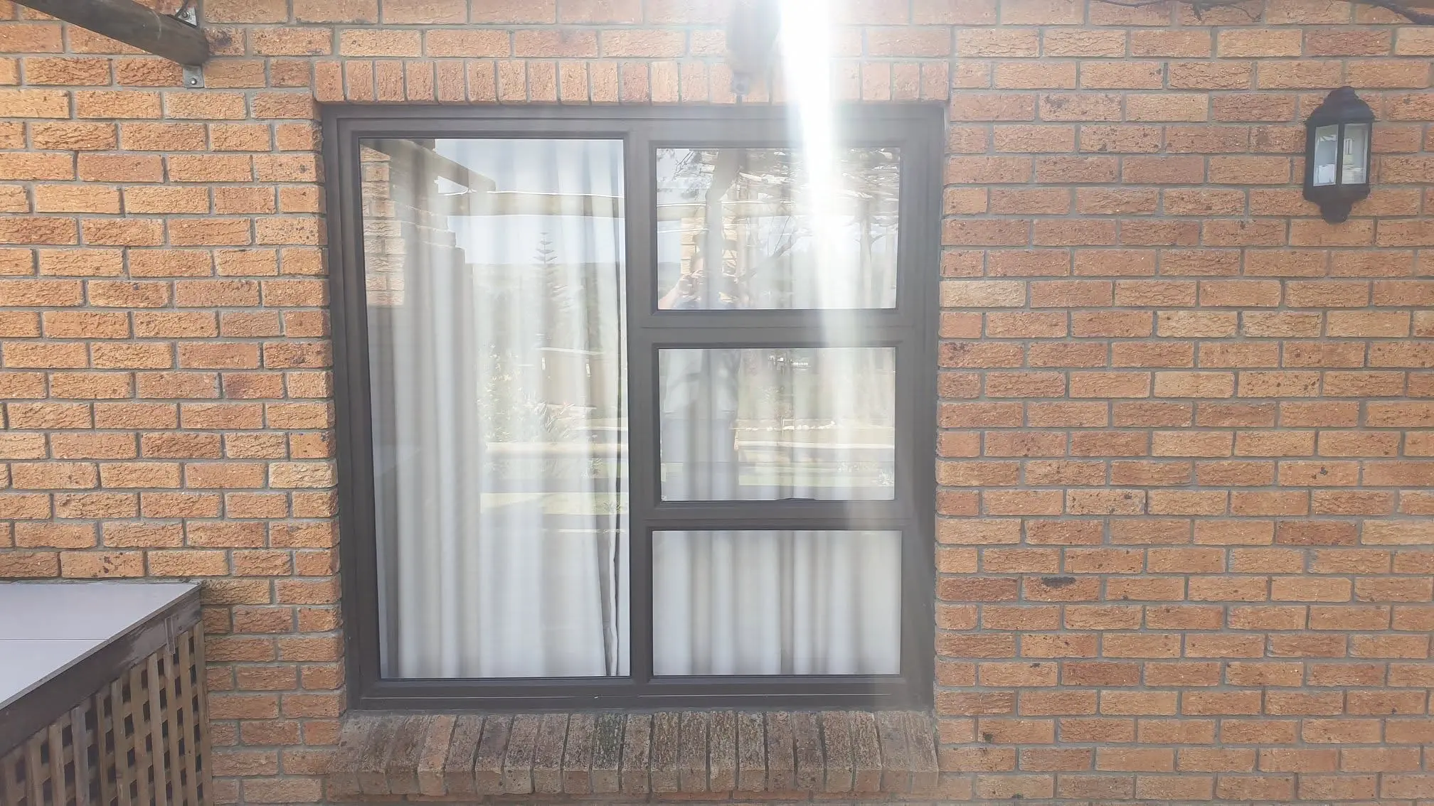 Completed bronze aluminium casement window at Lagoon Edge