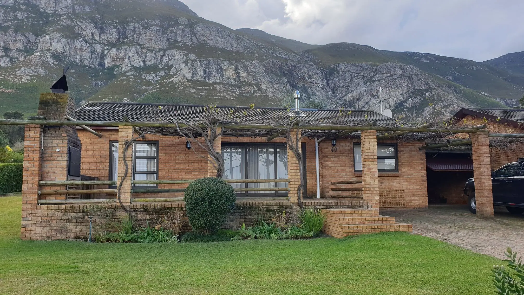 Lagoon Edge home and mountain setting before the timber-window replacement