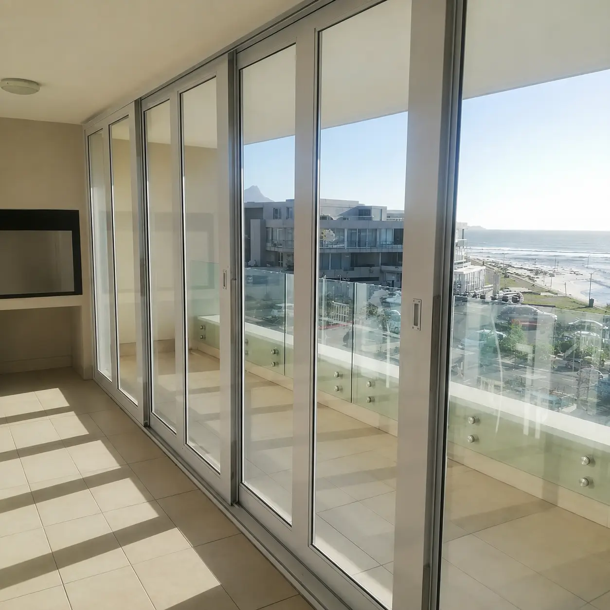 Ocean-facing view through the four-panel Palace door in Milnerton